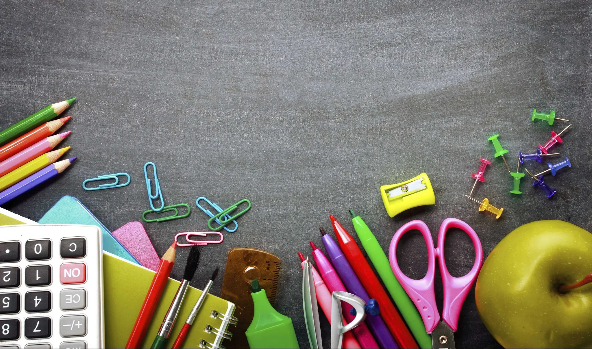 School supplies on blackboard background